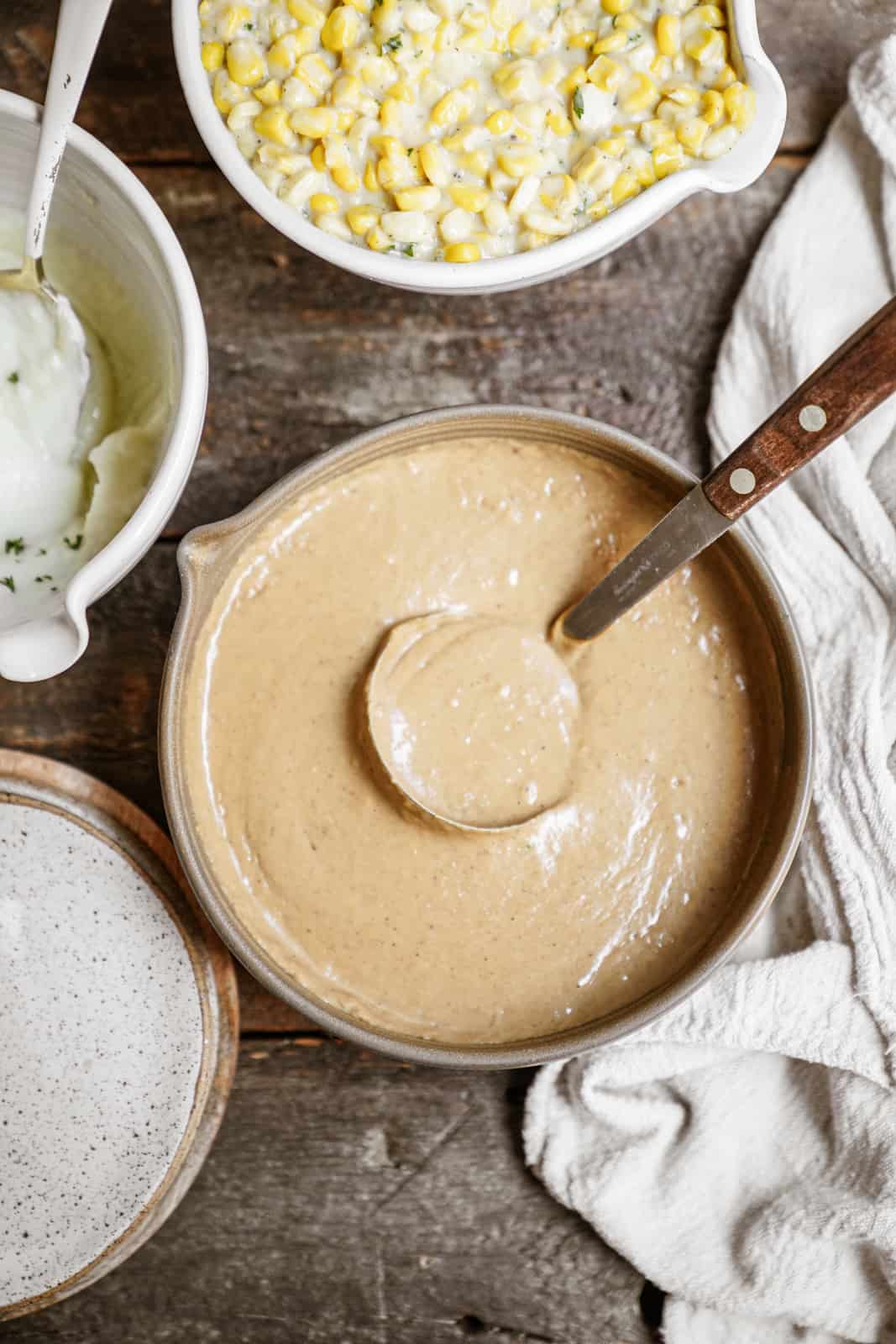 Pot of vegan gravy with ladle in it.