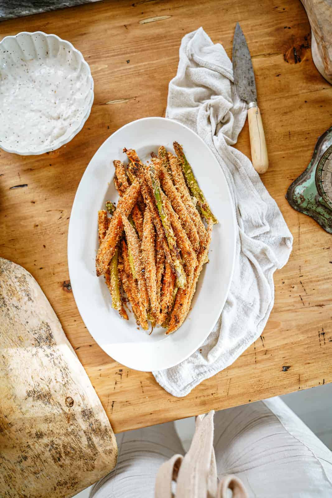 Crispy sweet potato & asparagus fries on a serving platter.