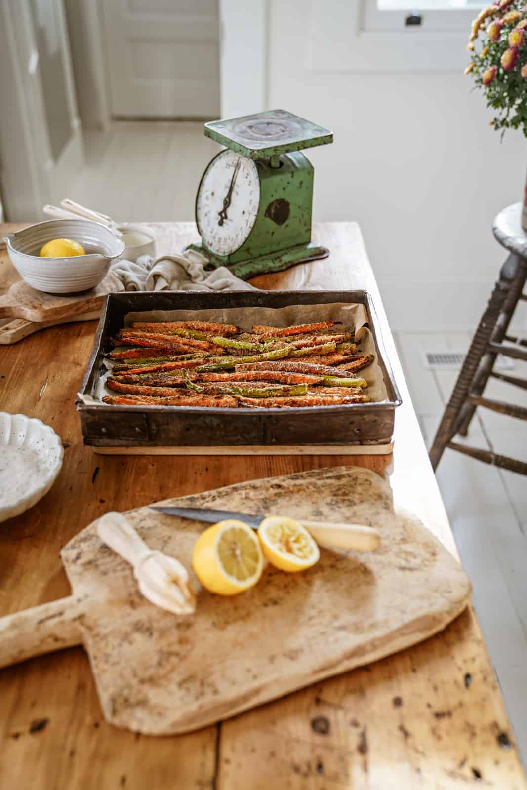 Sweet potatoes & asparagus in a serving dish ready to bake. 