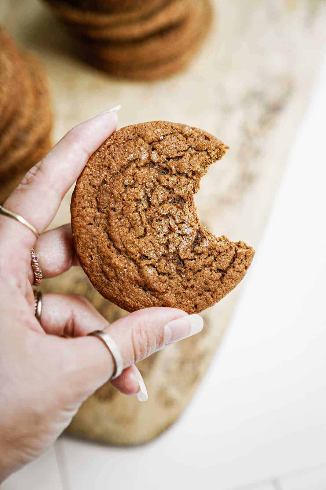 One of the best christmas cookie recipes - ginger snaps with a bite out of one cookie