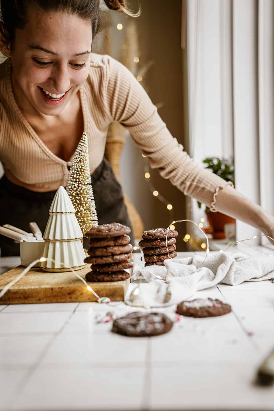 Maria's sister looking at stacks of Chocolate Peppermint Cookies