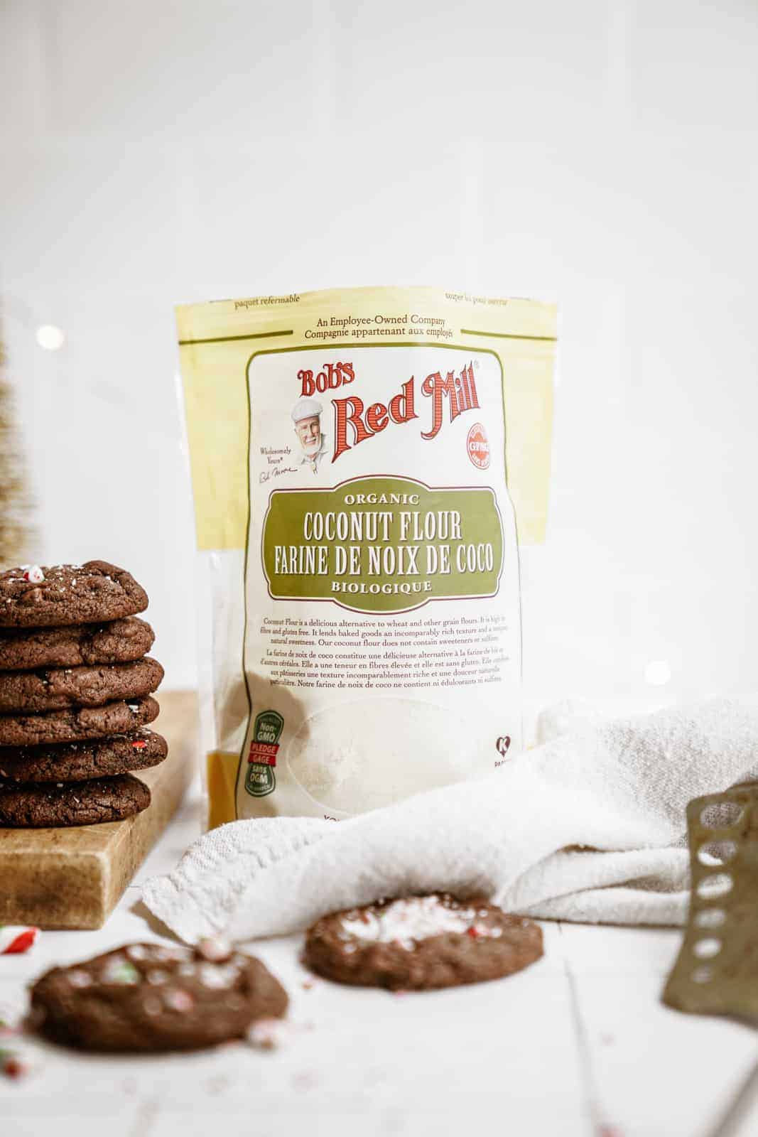 Bag of coconut flour next to stack of Chocolate Peppermint Cookies