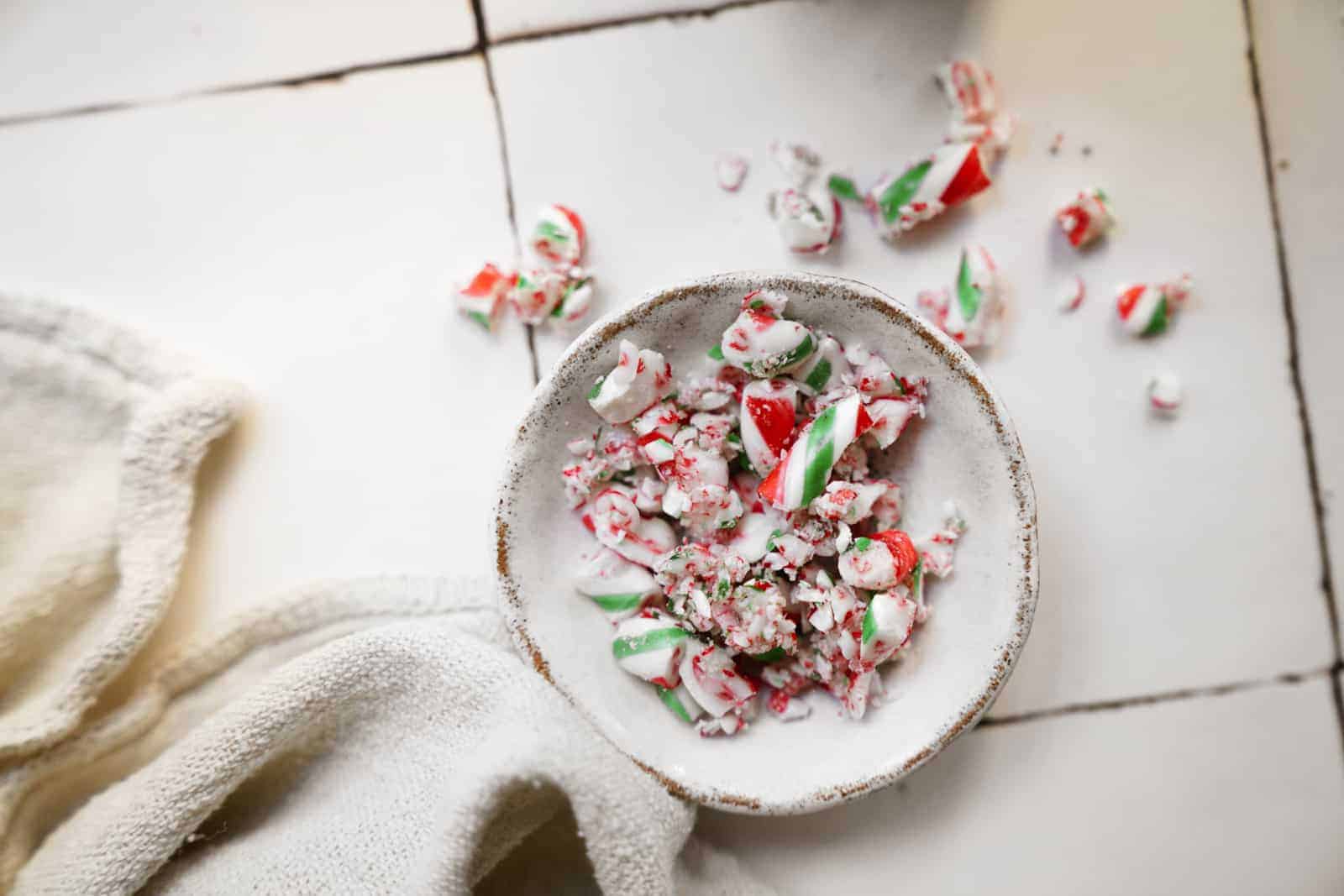 Sprinkled candy canes in a bowl.