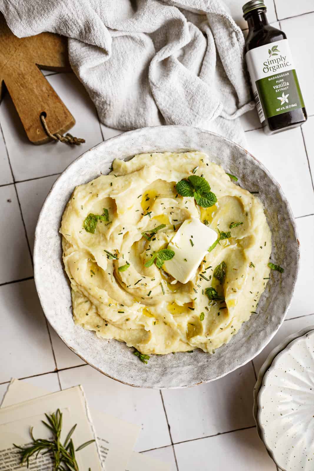 Parsnip Mash in serving bowl with melted vegan butter on top.