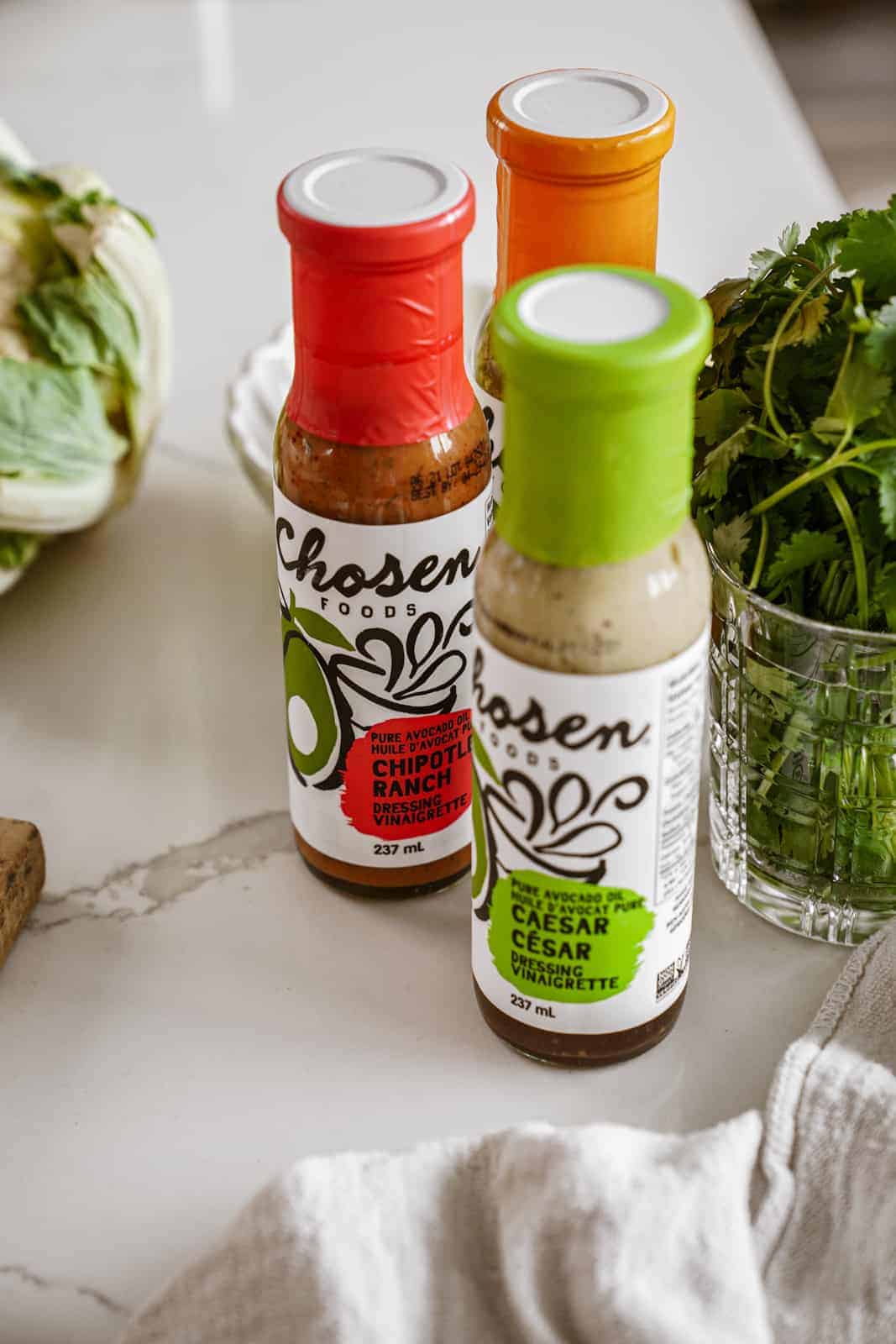 Chosen Foods salad dressings on countertop for Tofu Power Bowl