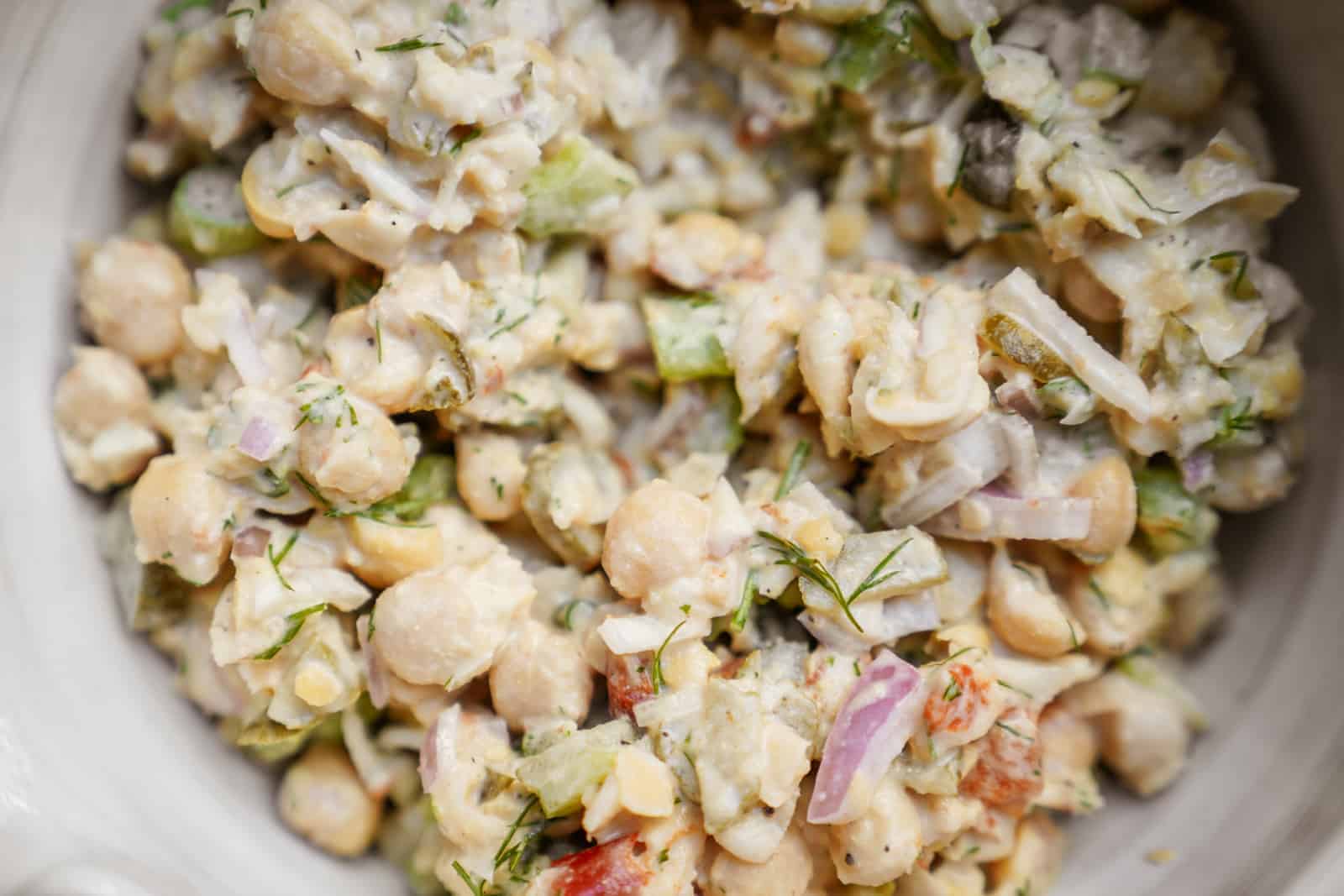 Mashed Chickpea Salad close-up in a white bowl