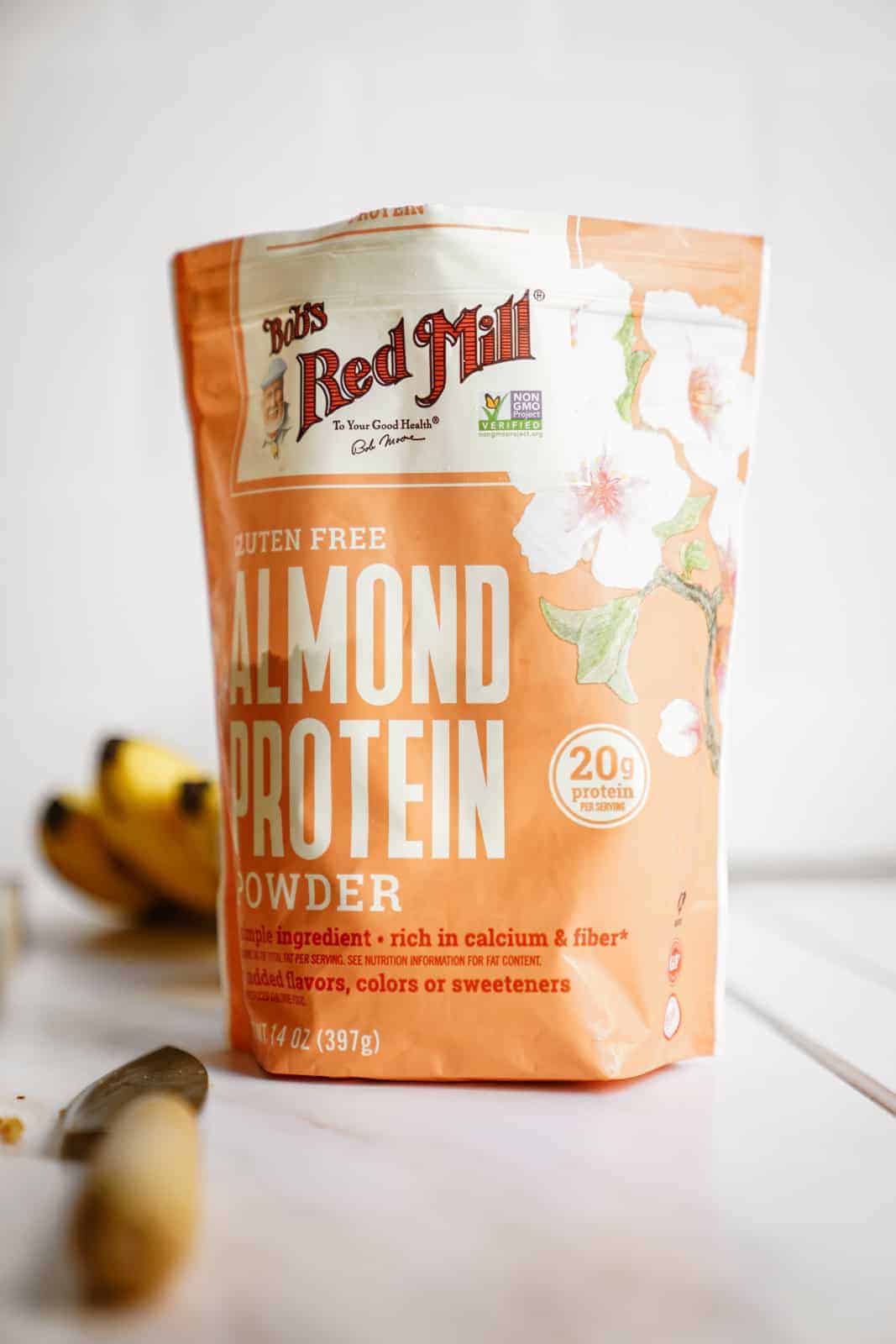Bob's Red Mill Almond Protein Powder on counter for healthy banana bread