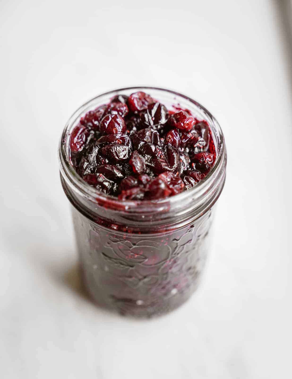 Jar of vegan cranberry sauce made from scratch.