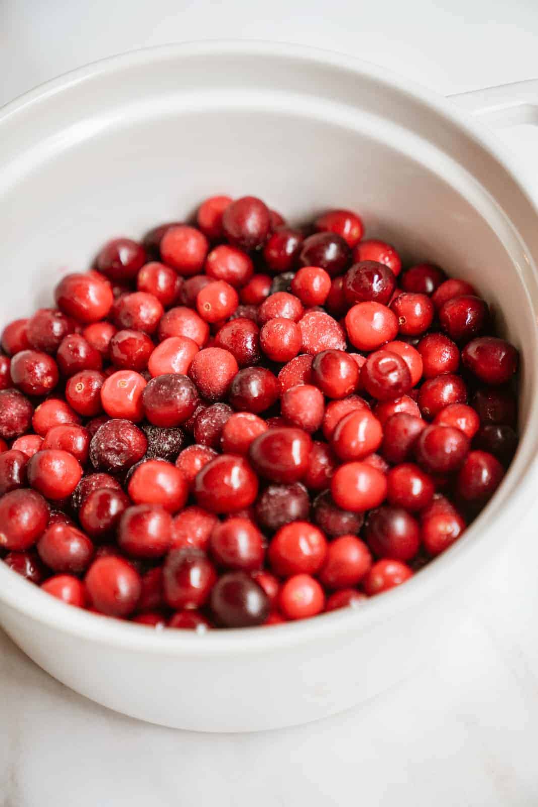 Bowl of fresh cranberries for vegan cranberry sauce
