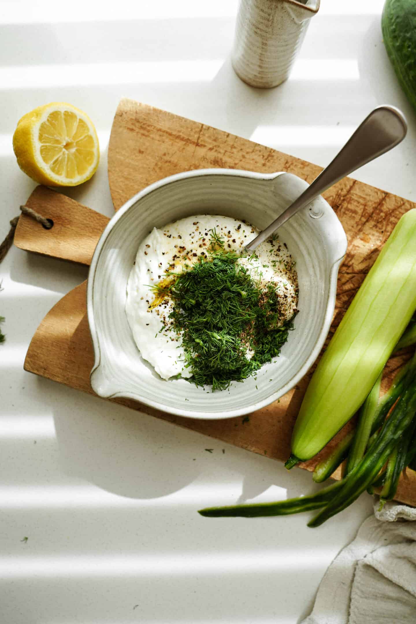 Greek tzatziki sauce on countertop in bowl