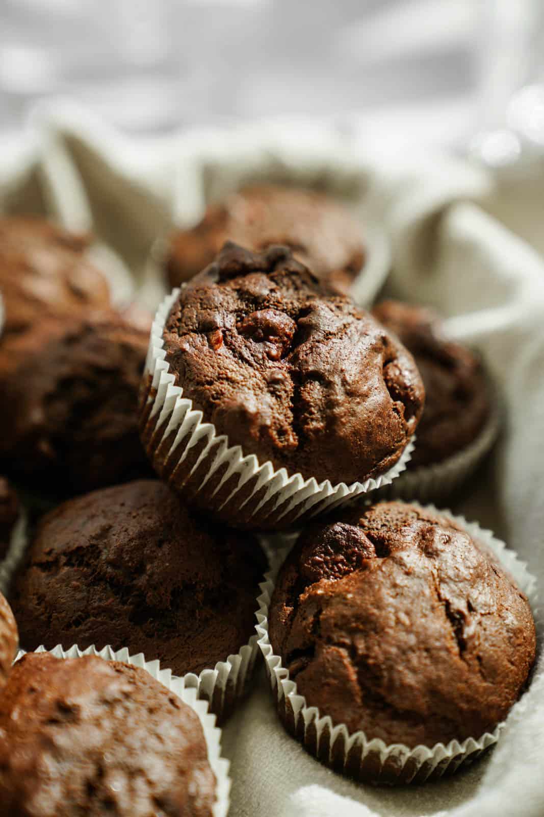 Close-up of Chocolate Avocado Muffins in a basket.