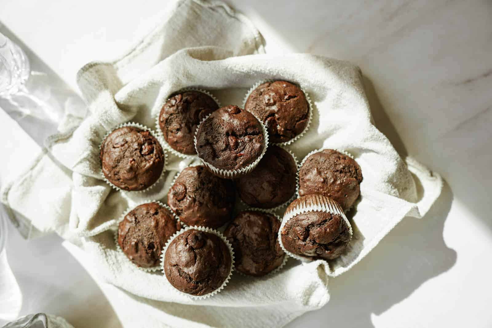 Chocolate Avocado Muffins in a basket.