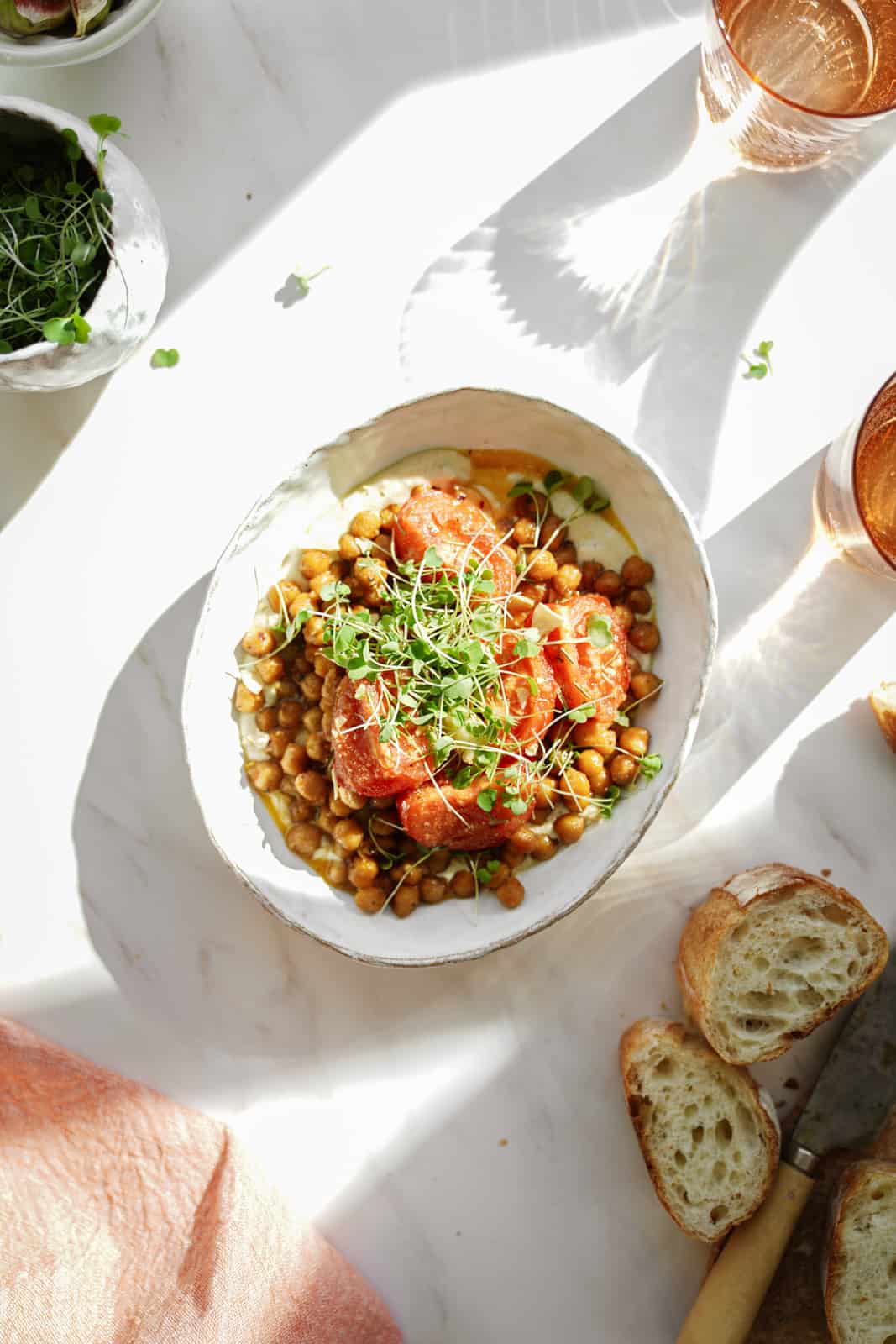 oven-roasted chickpeas on a table in a white serving bowl