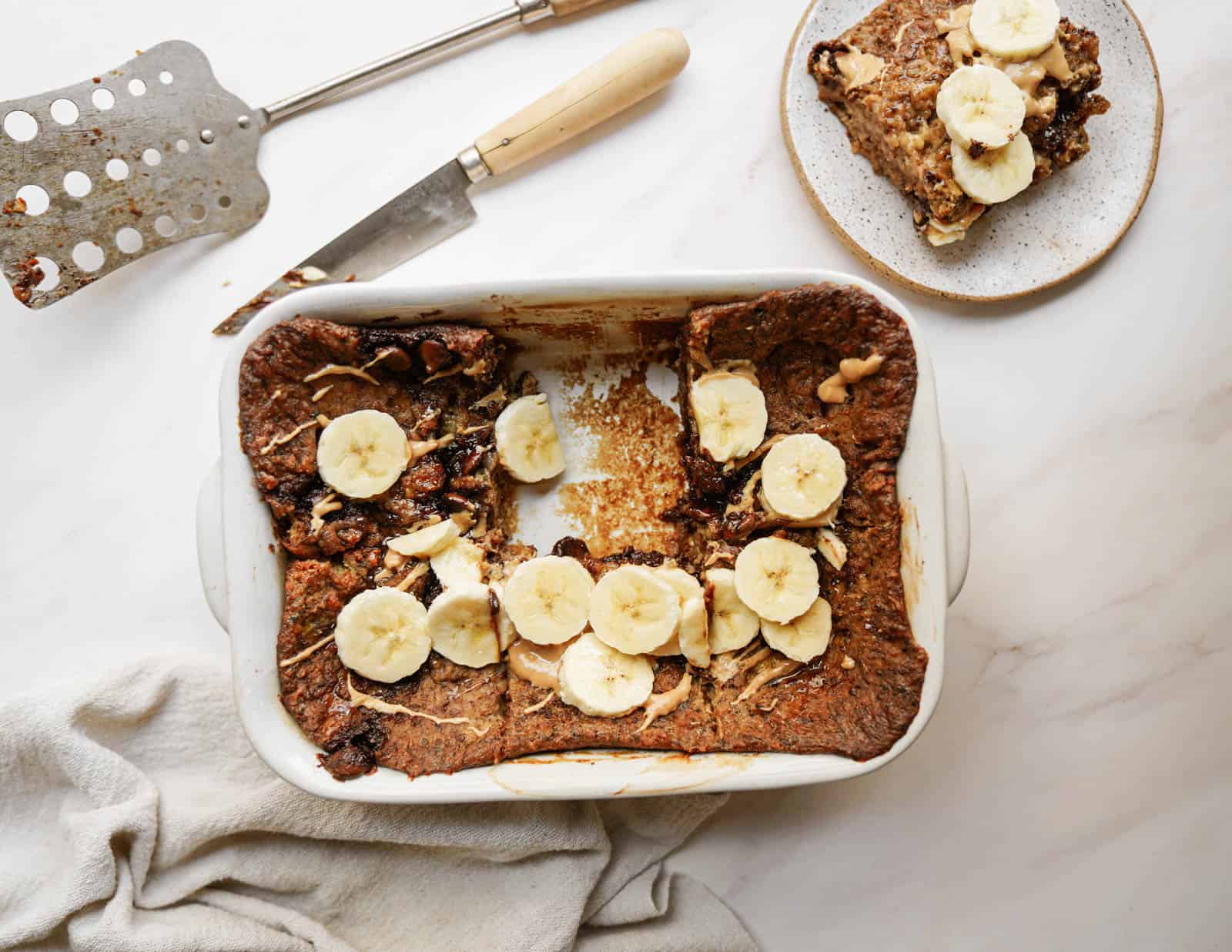 Vegan baked oatmeal with bananas cut on top.