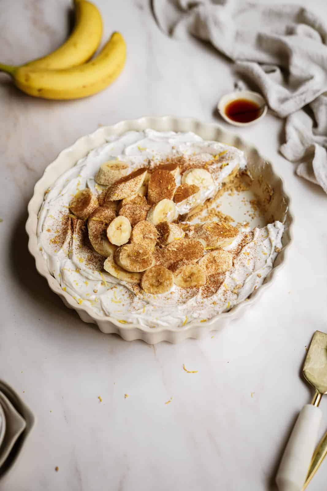 Easy Vegan Banana Cream Pie on countertop in pie plate