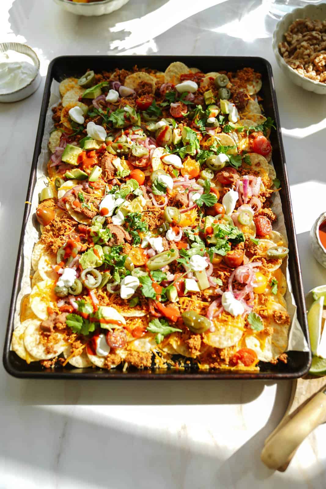 Vegan Taco Meat Nachos on a big baking sheet