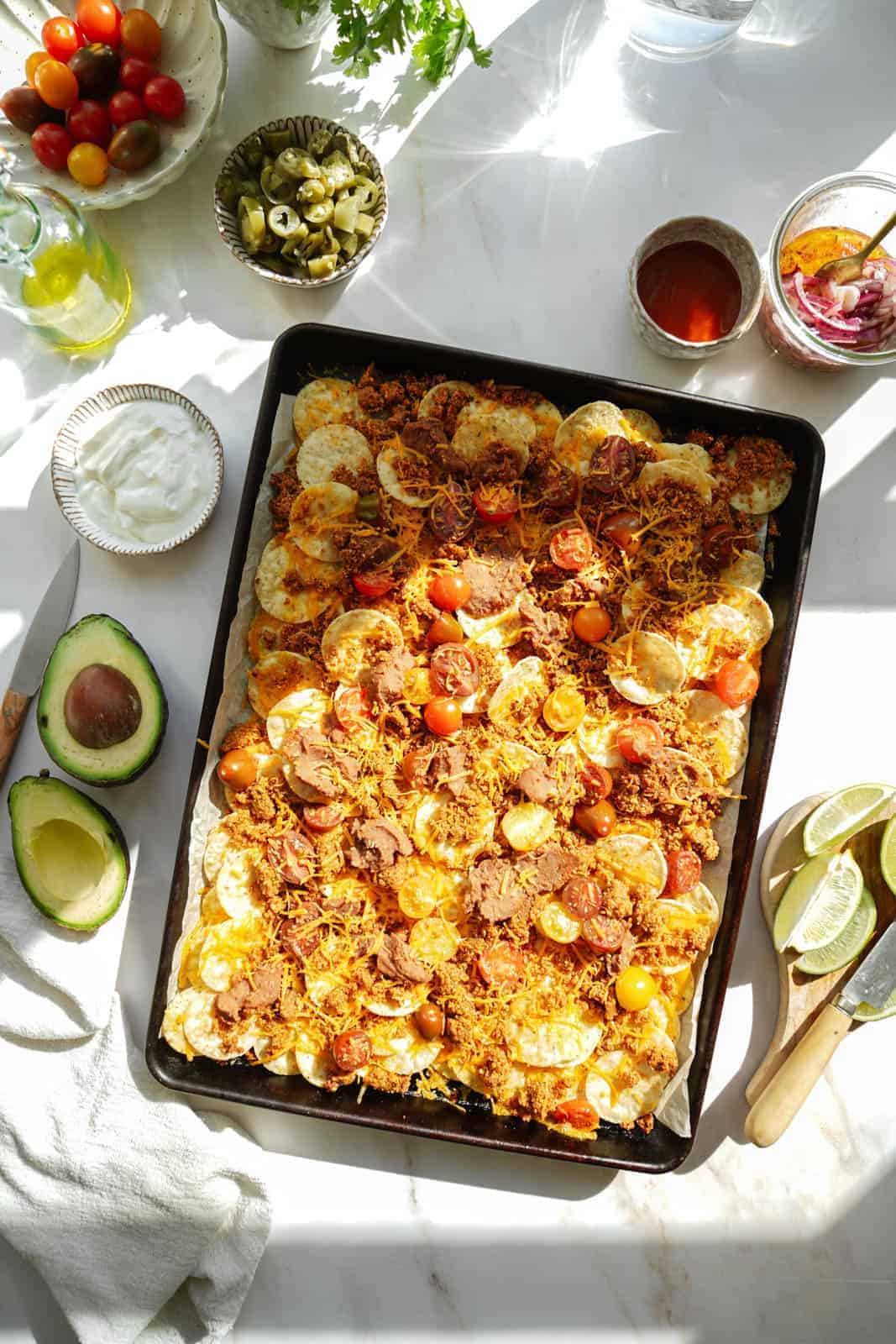 Vegan Taco Meat Nachos on a big baking sheet