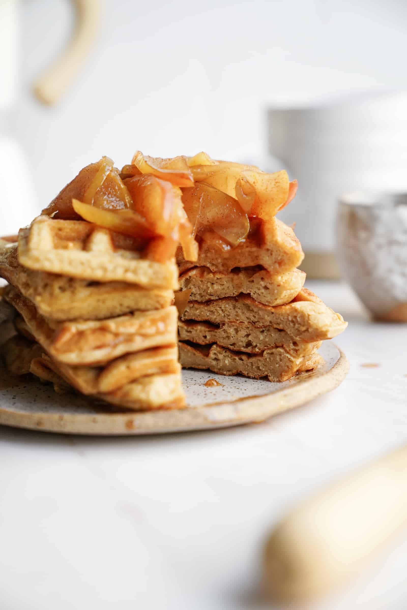 Apple Cinnamon Waffles stacked on a plate