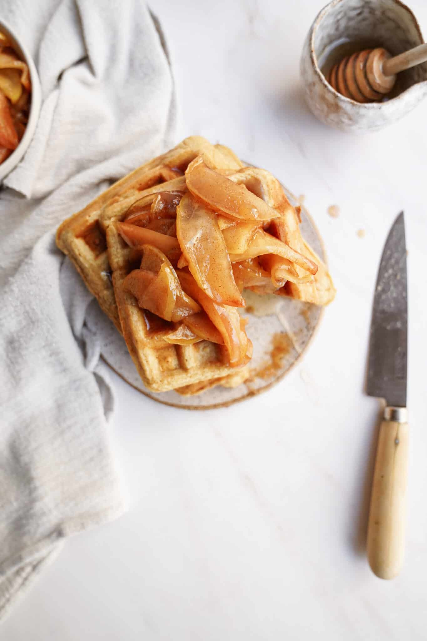 Apple Cinnamon Waffles stacked on a plate