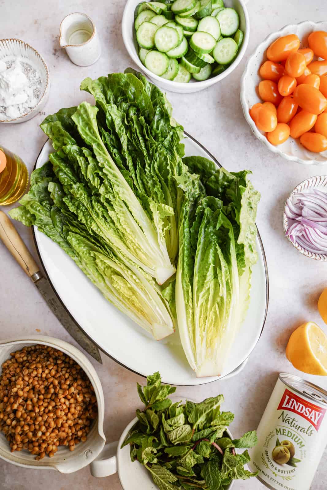 fresh ingredients for grilled romaine salad on countertop