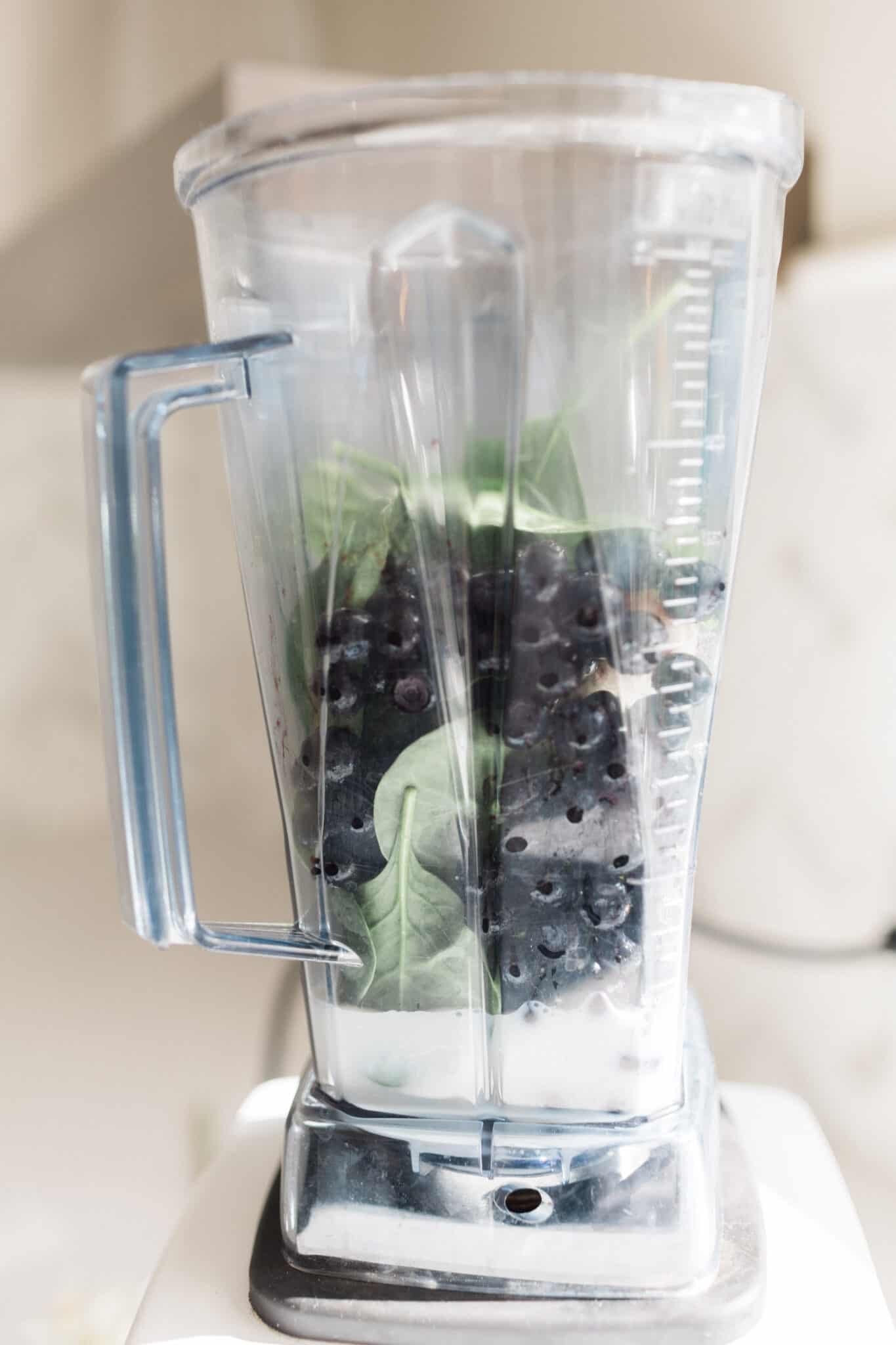 Ingredients in a blender for banana berry smoothie