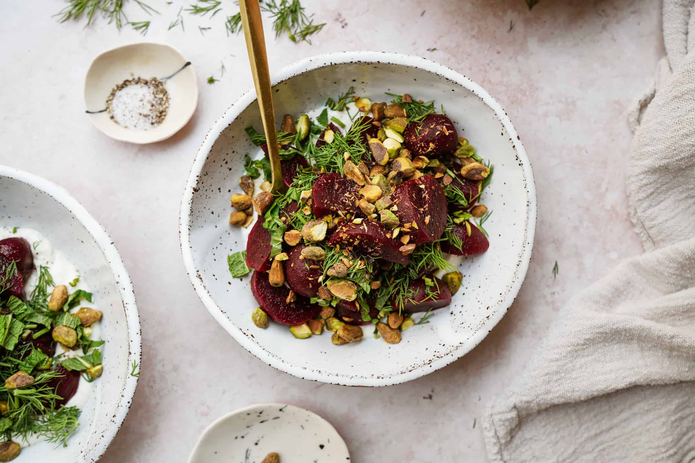 Roasted beet salad with feta on plate with fork