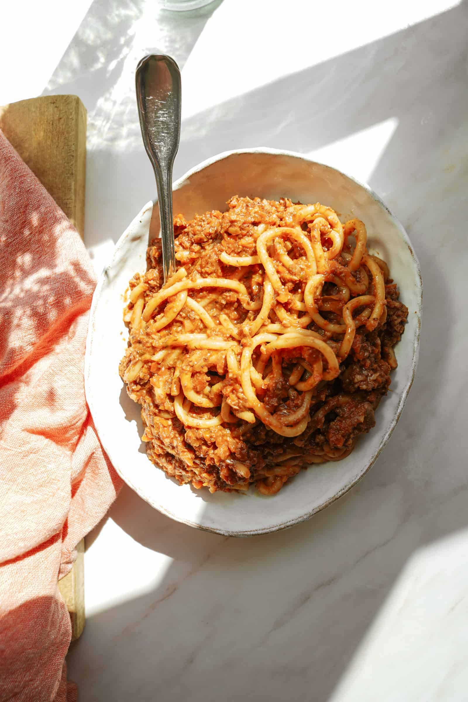 Vegan spaghetti with meat sauce on a serving dish