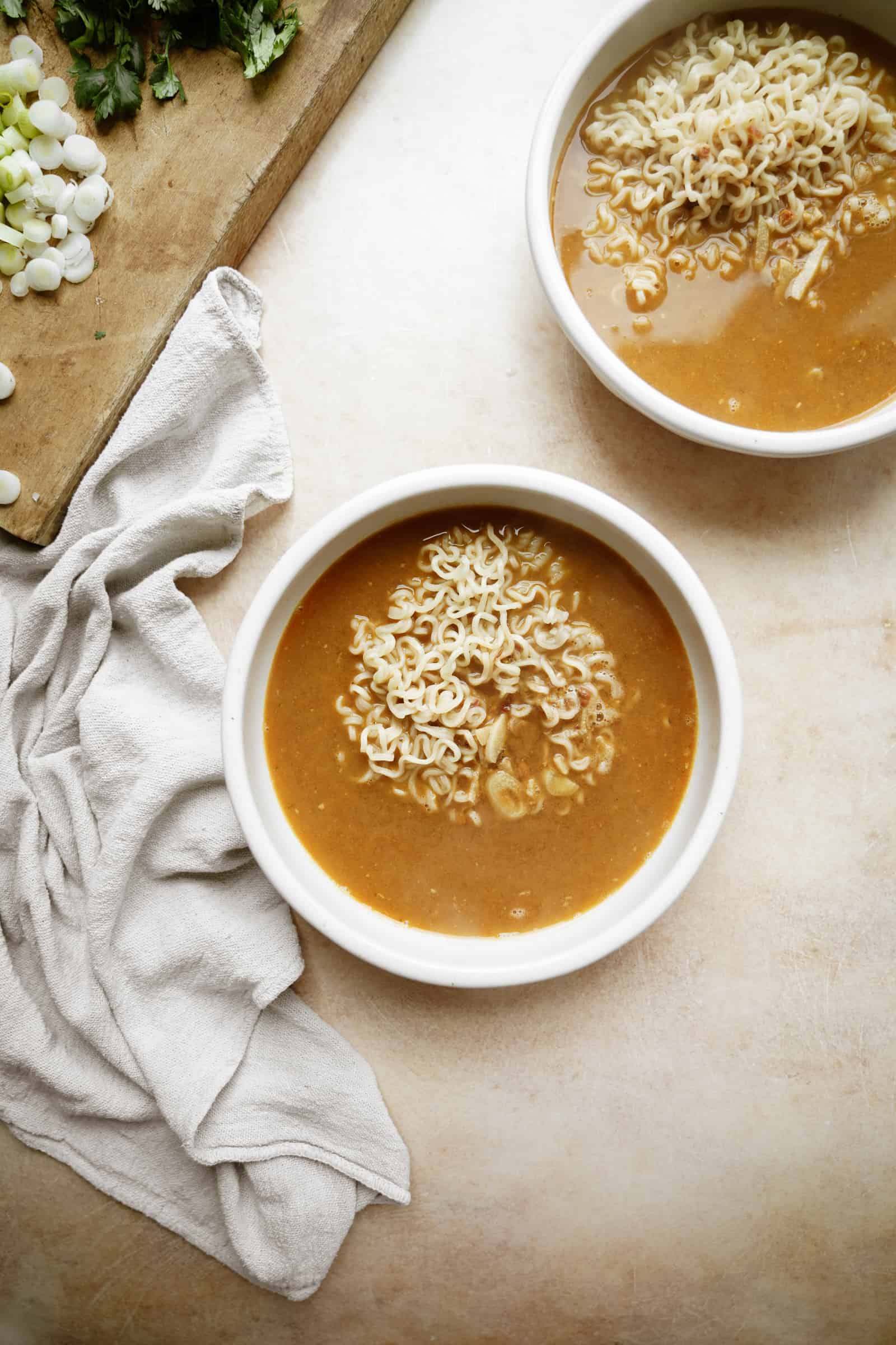 Broth and noodles in a bowl for vegan ramen
