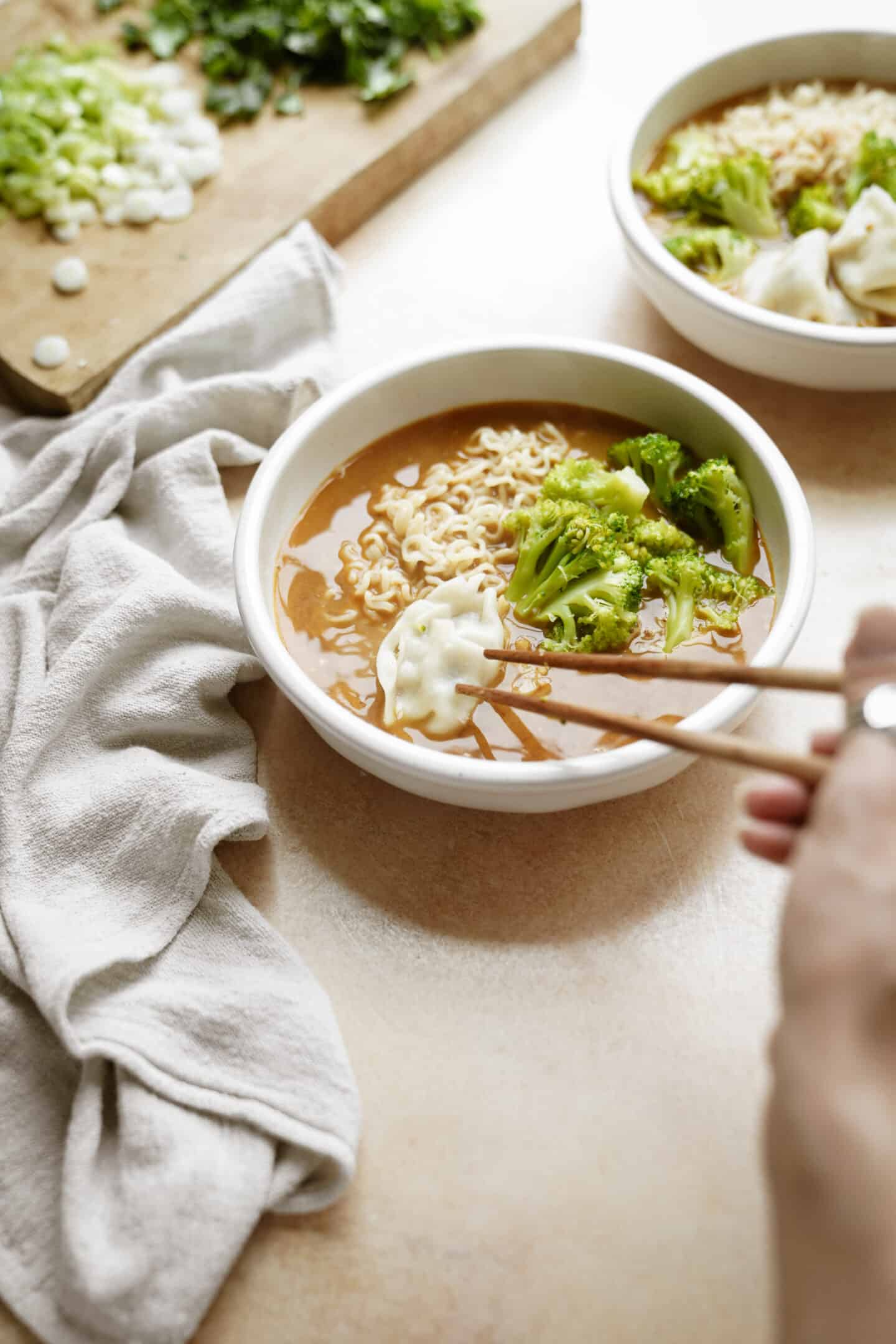 Dumpling soup in a white bowl