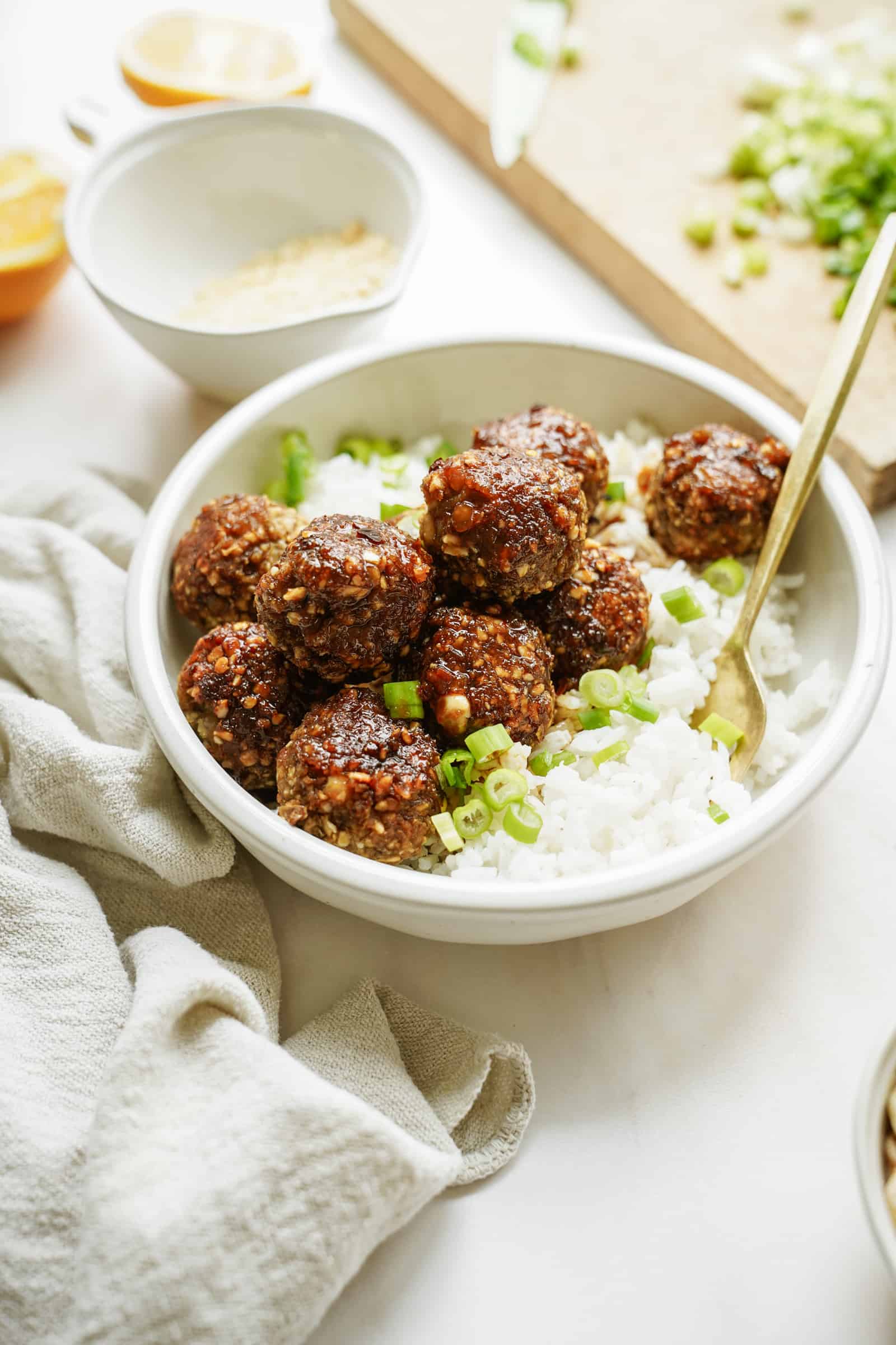 Sticky lentil meatballs in a bowl with rice