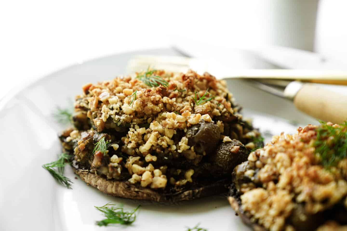 Close up of vegan stuffed portobello mushrooms on plate
