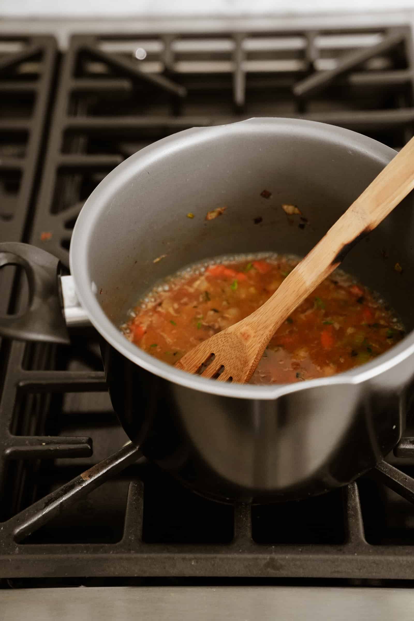 Vegetable soup in a pot on a stove