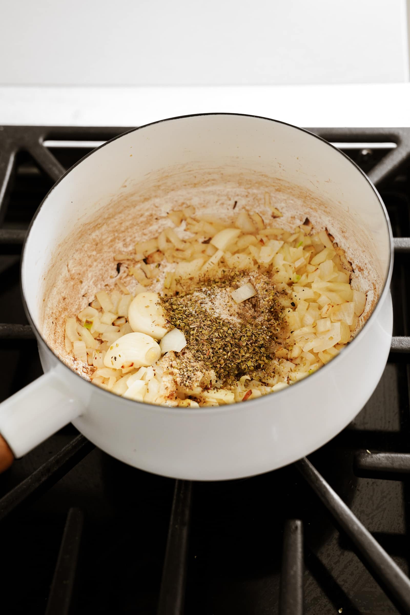 Spices with onion and garlic in a pot