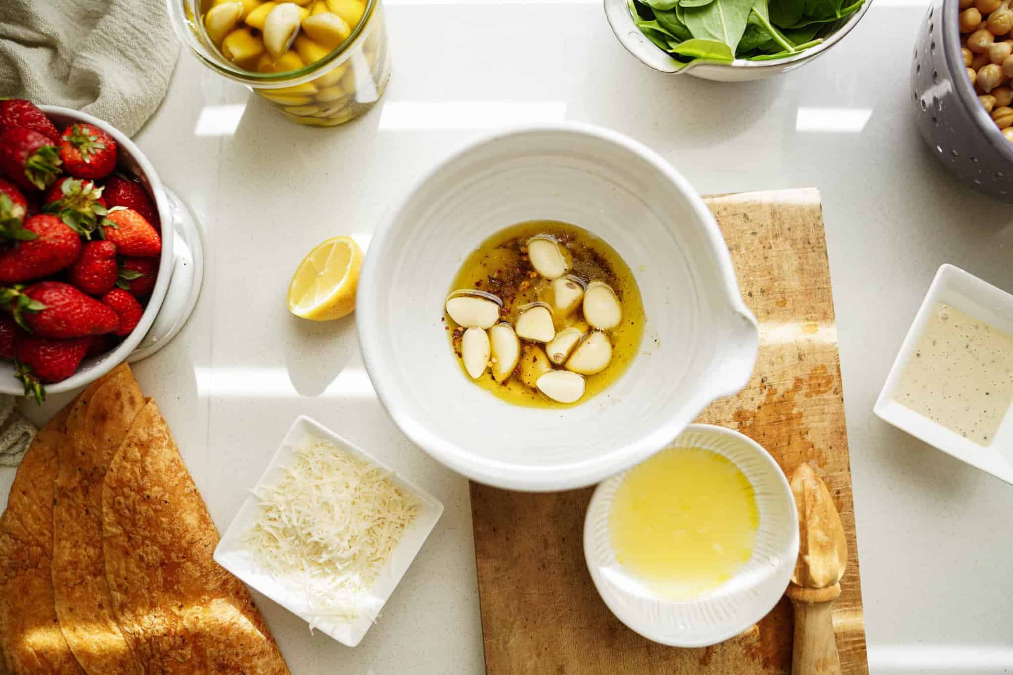 Ingredients for garlic confit for chickpea caesar salad wrap recipe