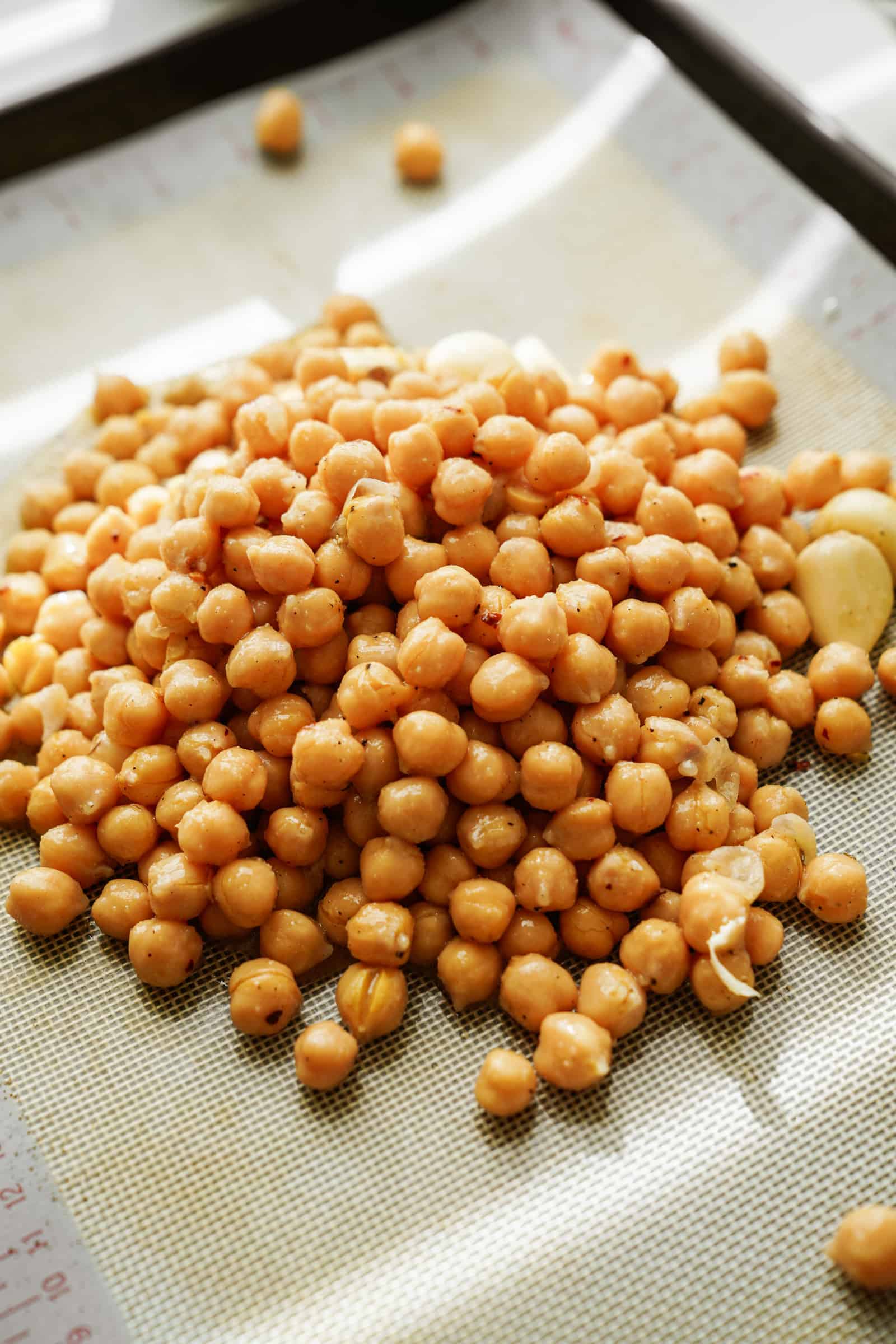 Chickpeas on a baking sheet for chickpea caesar salad wrap
