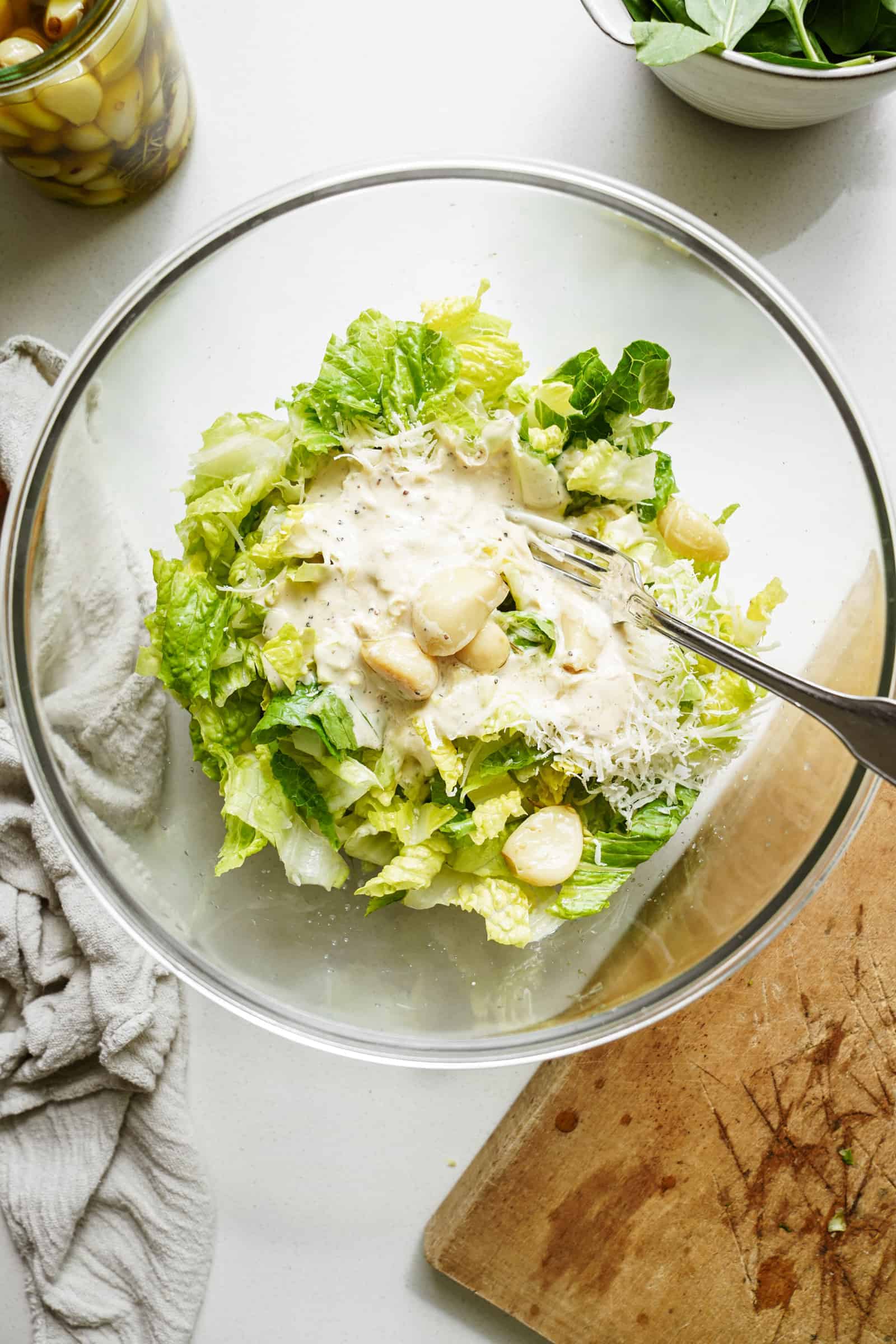 Lettuce and ingredients for chickpea caesar salad