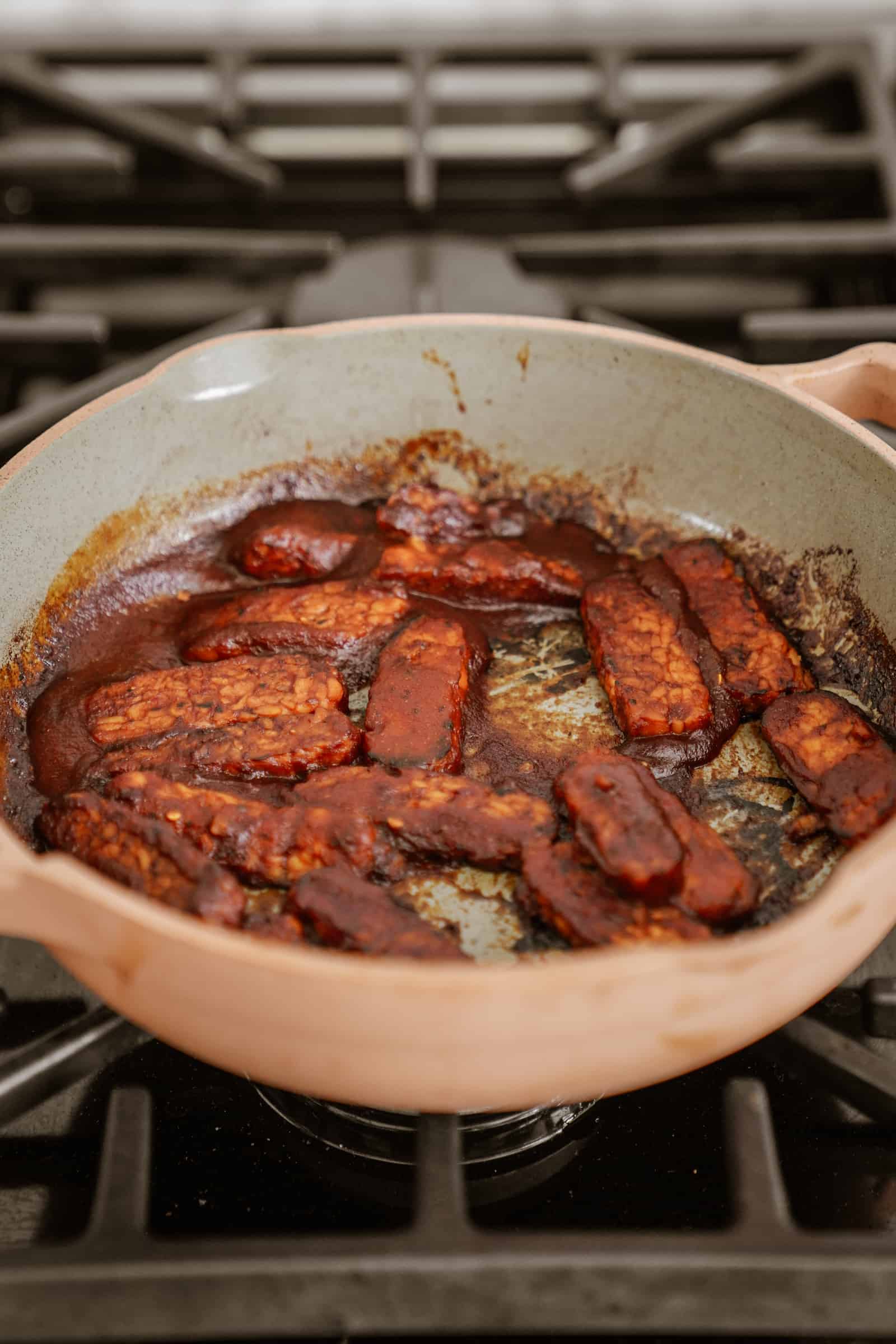 Tempeh in a pan with BBQ sauce