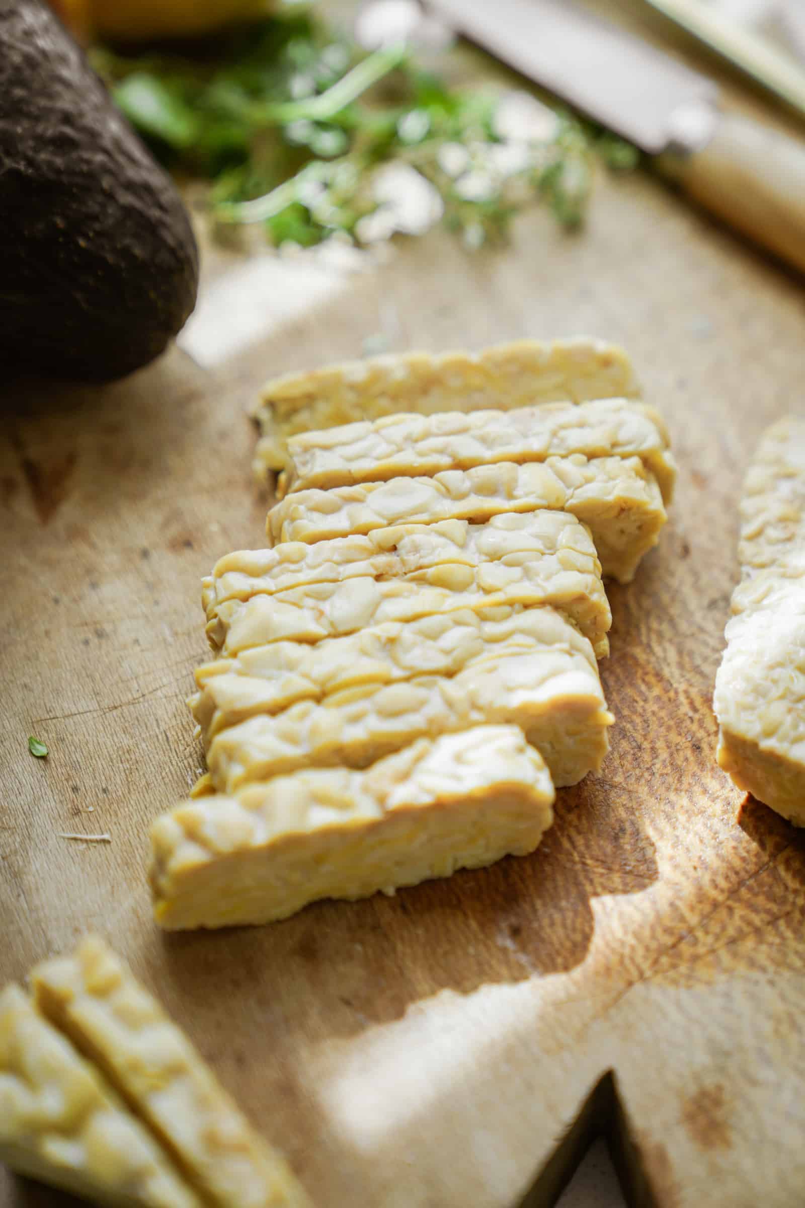 Raw tempeh on a cutting board