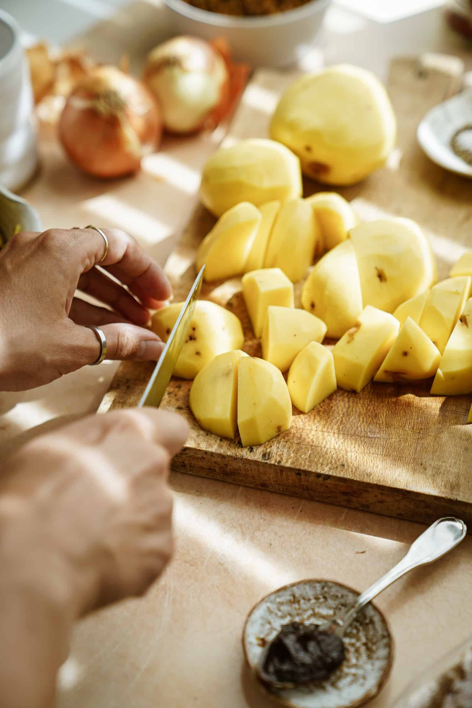 Cutting potatoes on a cutting board