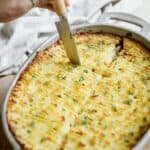 Cutting into a vegan shepherd's pie