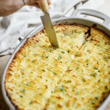 Cutting into a vegan shepherd's pie