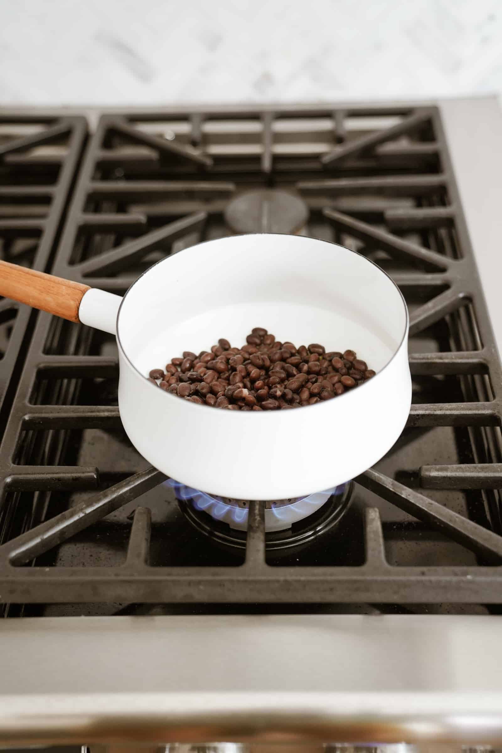 Beans in a pot over the stove for Vegetarian Black Bean Tacos