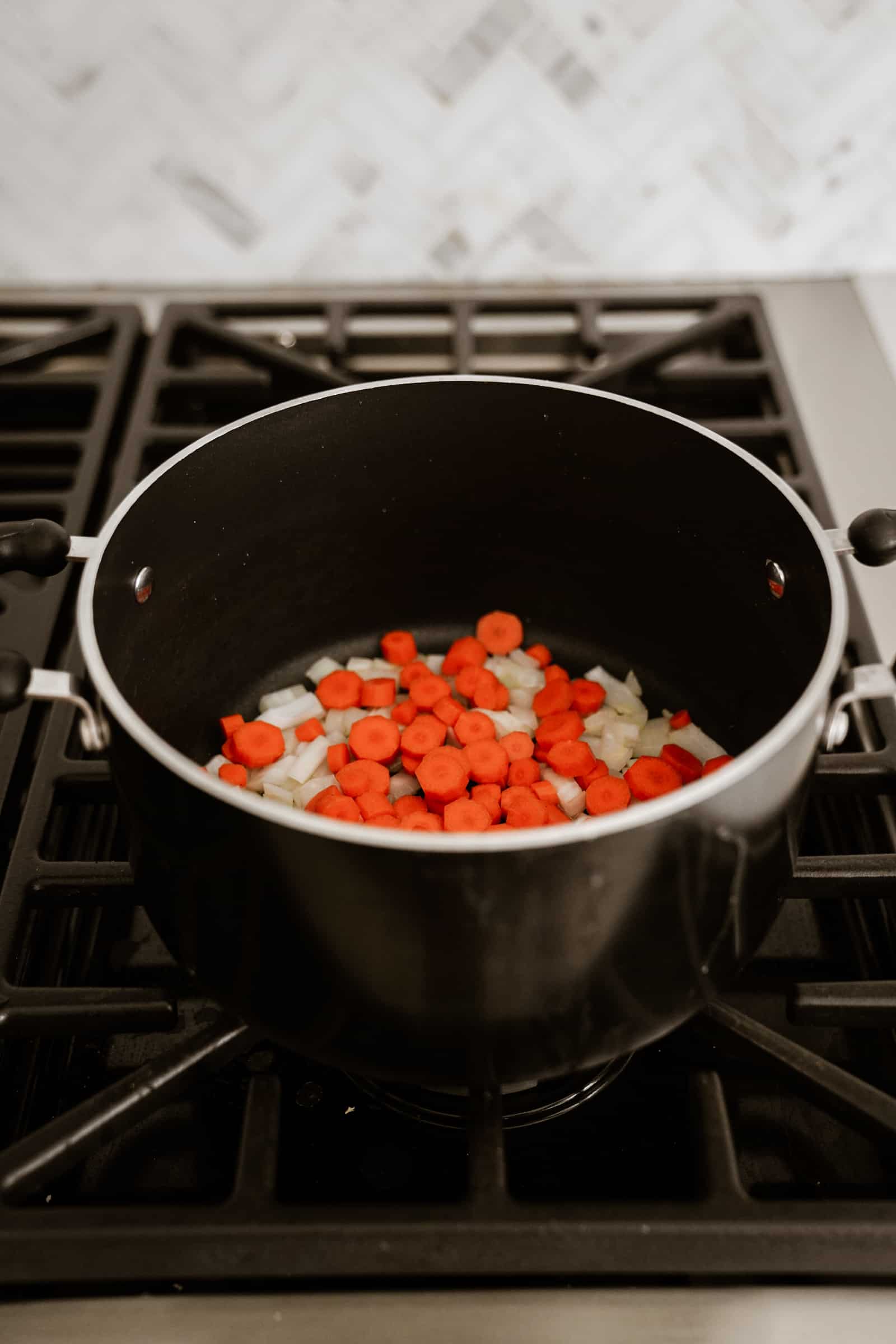 Veggies in a large soup pot for lemon rice soup