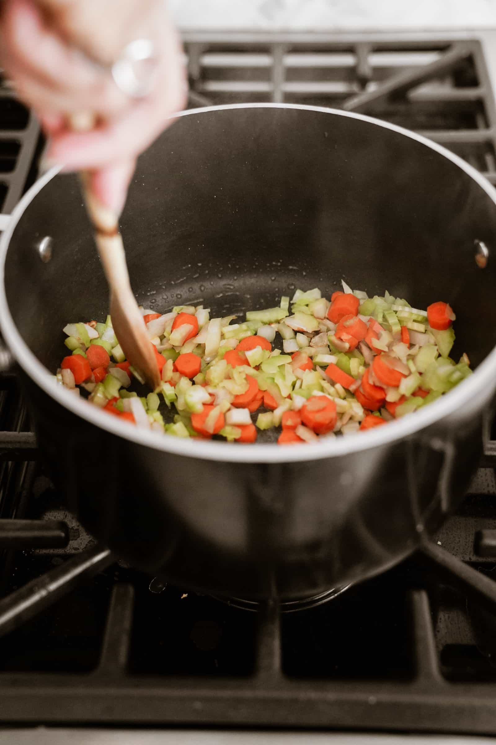 Veggies cookie in pot for lemon rice soup