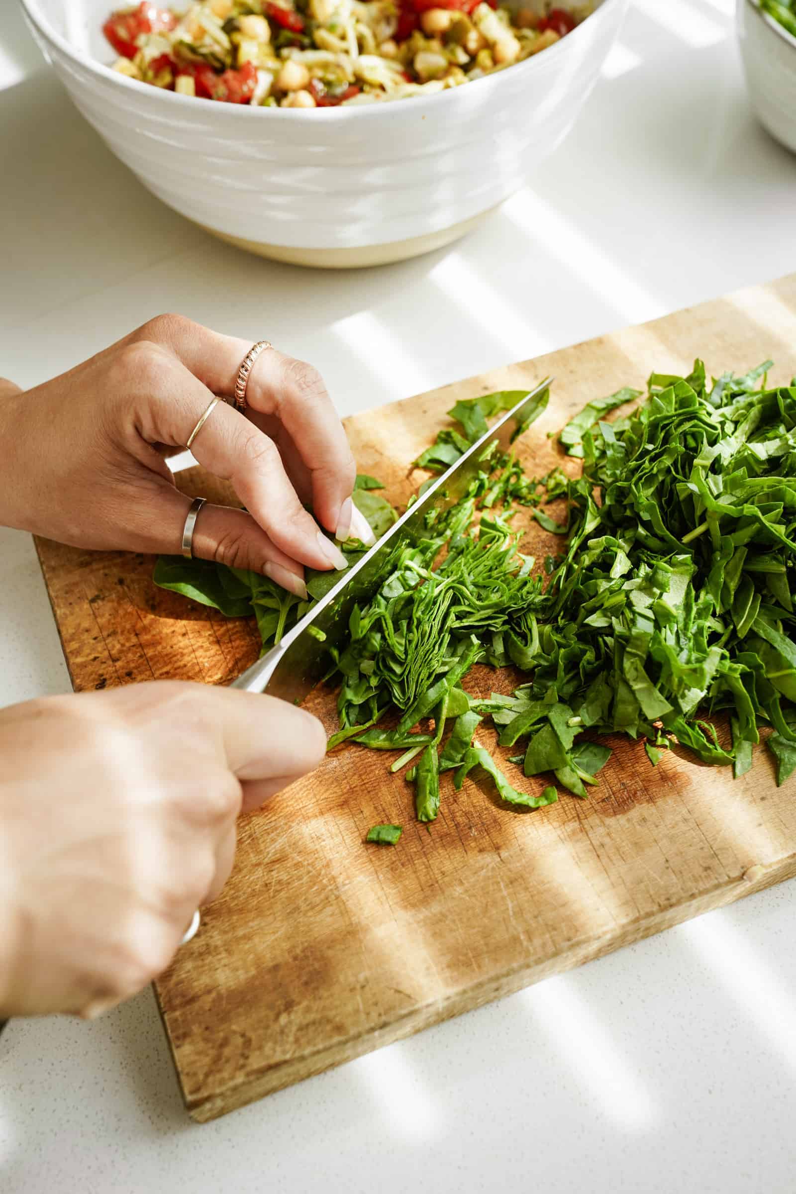 Chopping parsley on a cutting board