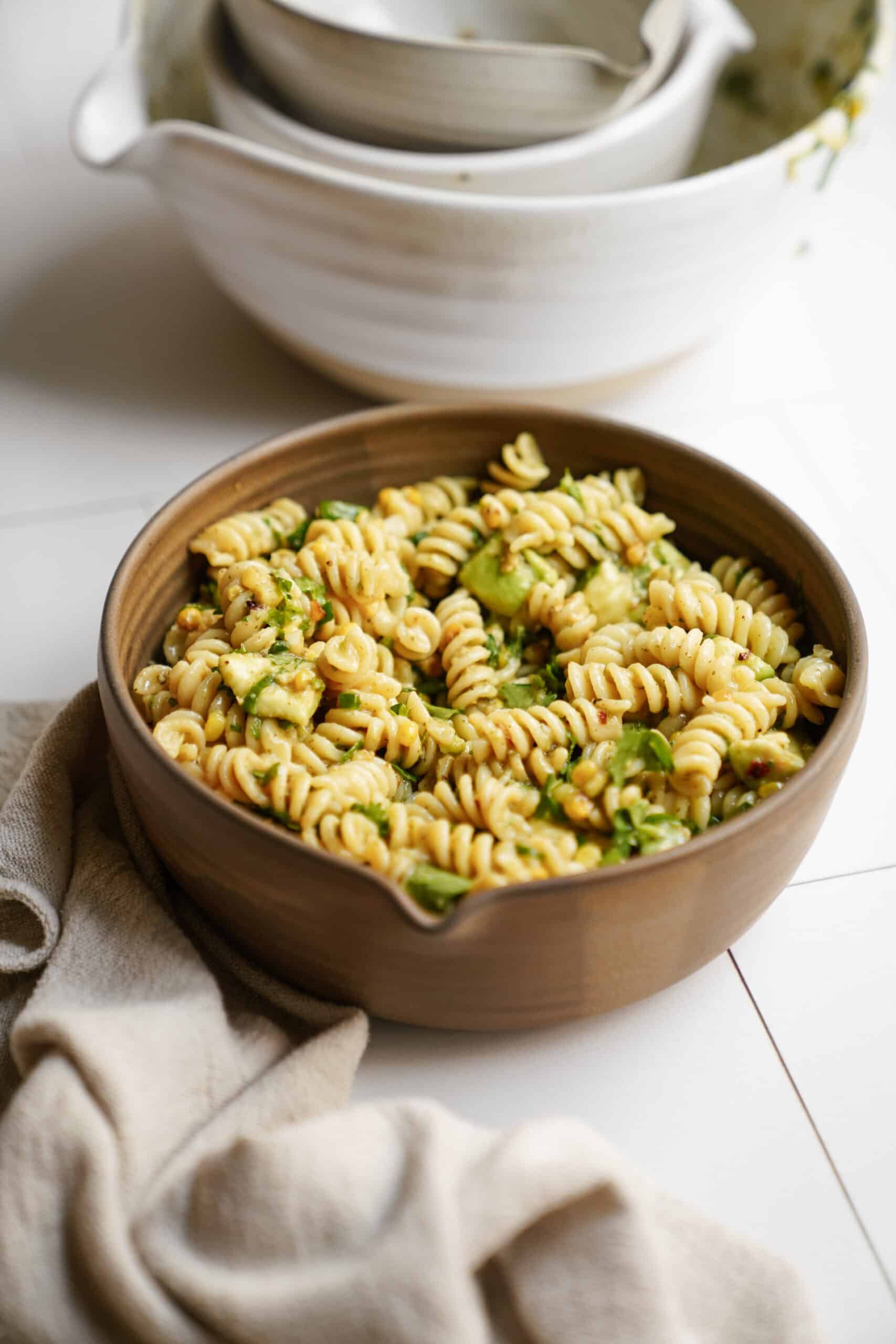 avocado pasta salad in serving bowl