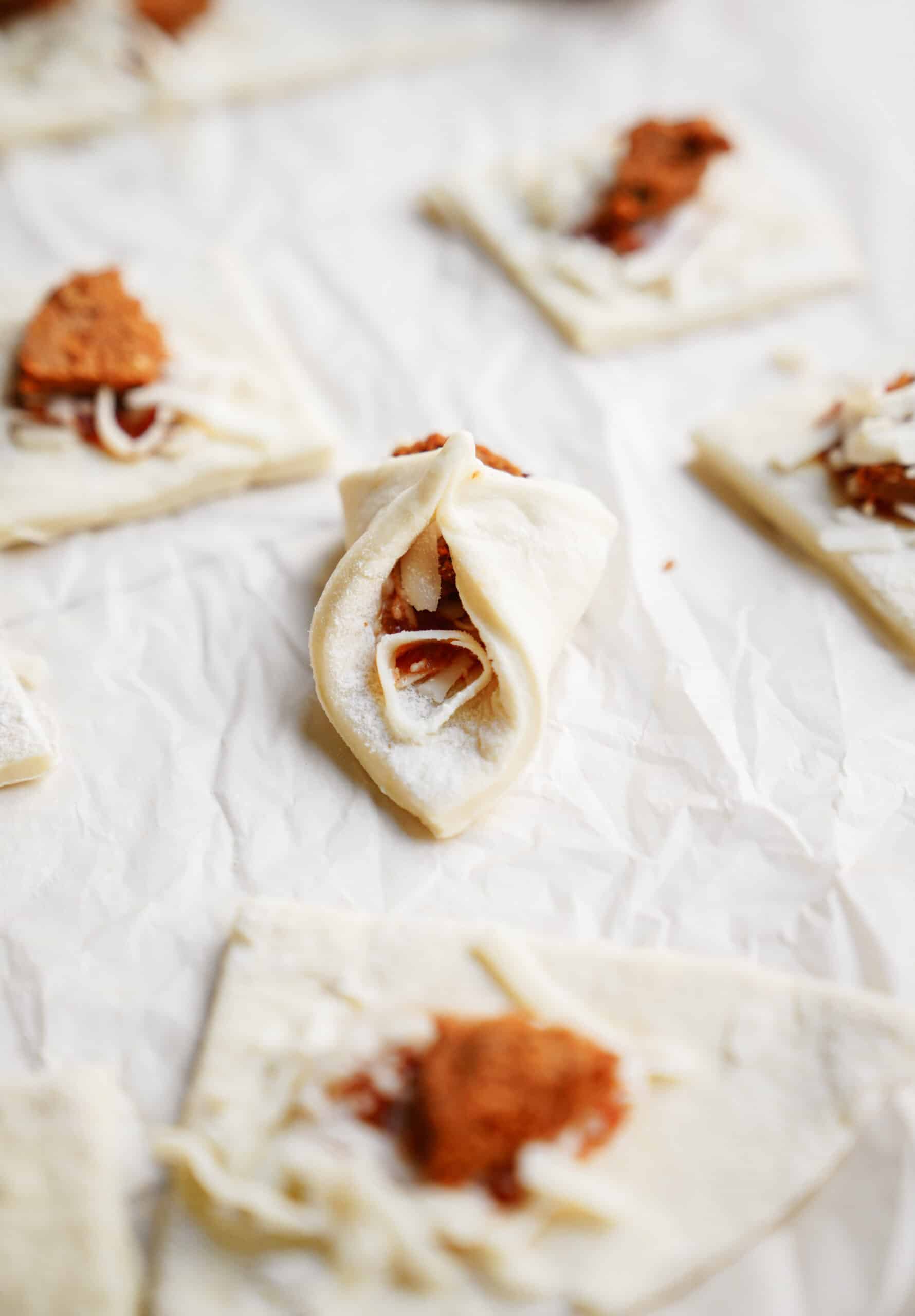 Homemade Pizza Pockets on parchment paper