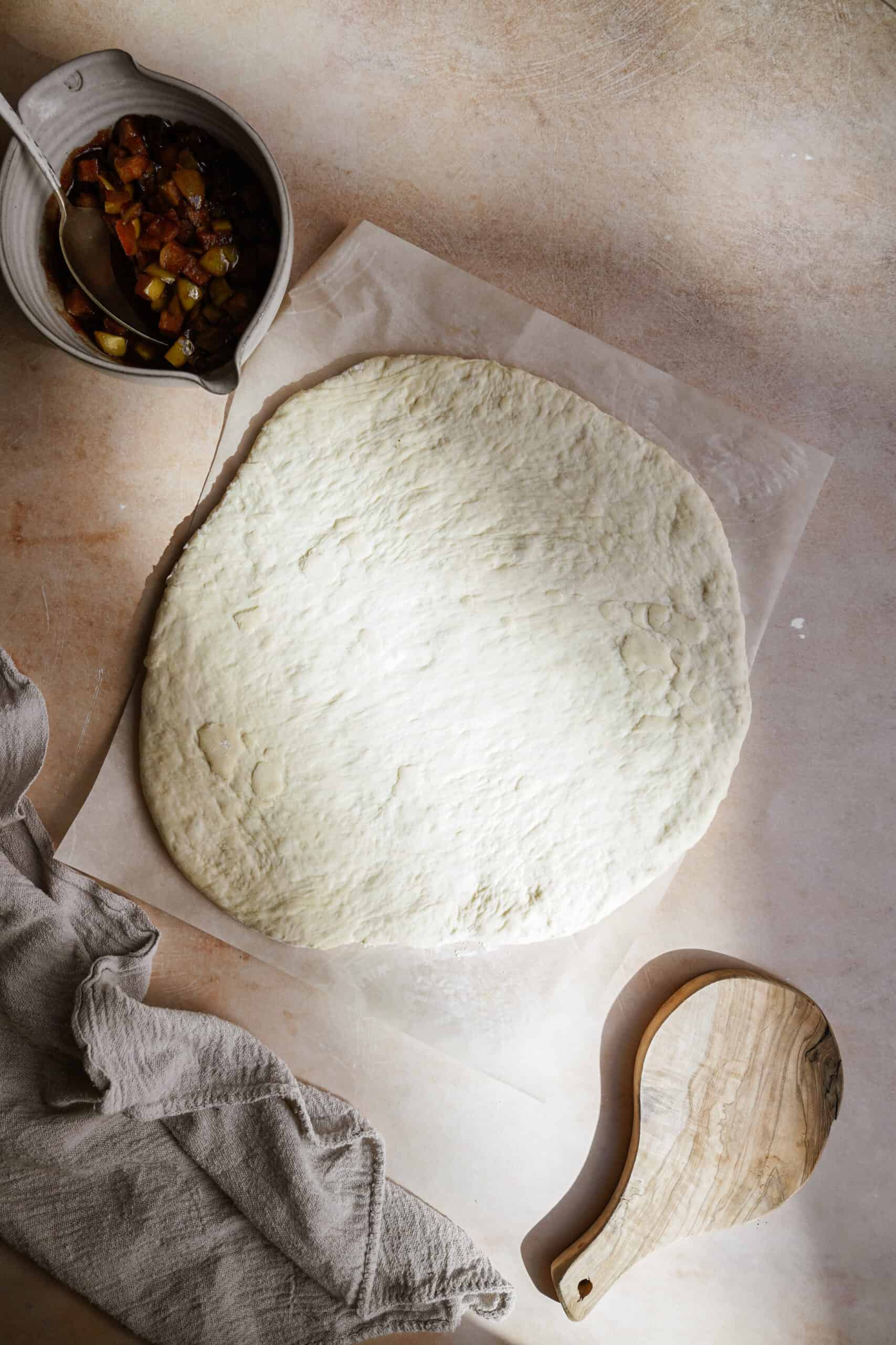 Dough for apple fritters on a board