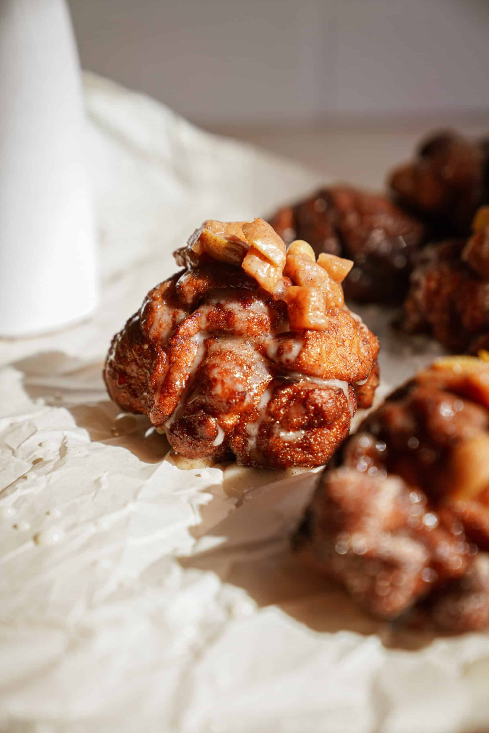 Apple fritters on parchment paper 