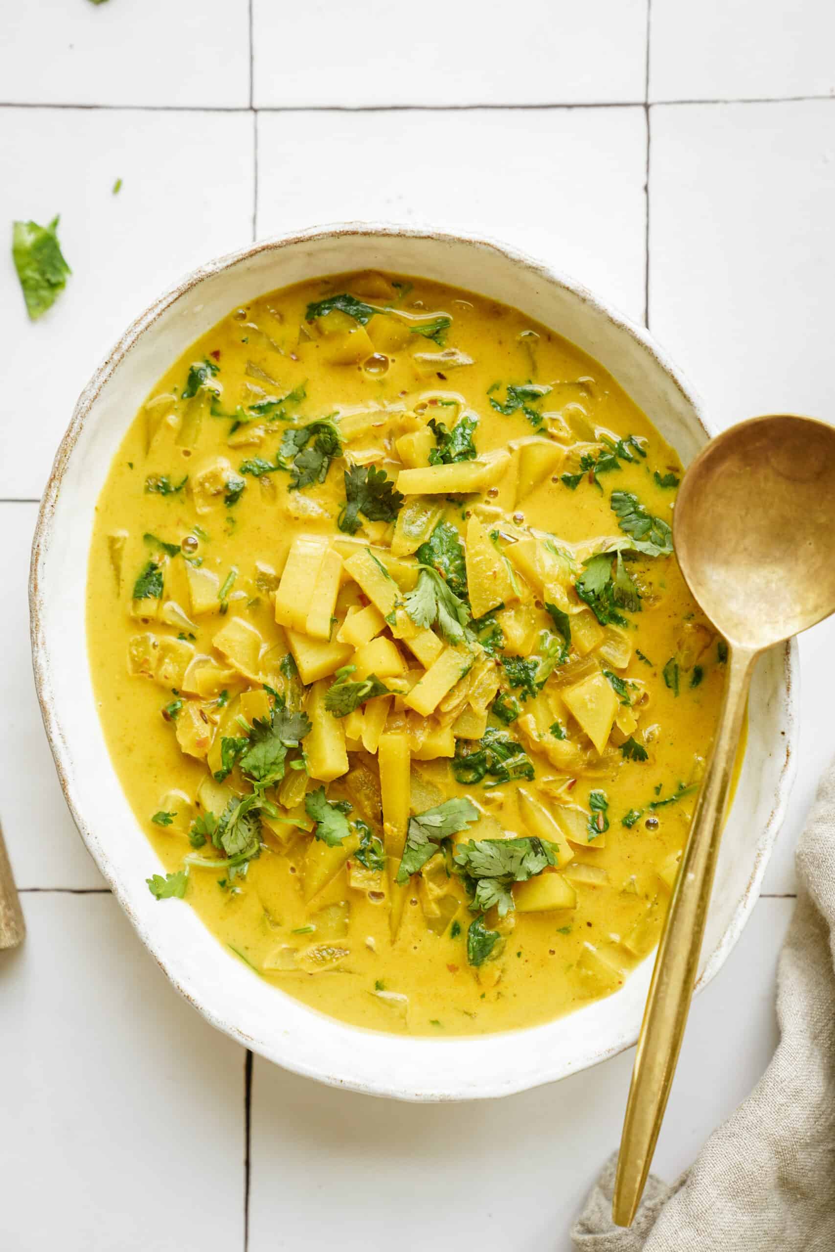 Curry potato soup in a large serving dish